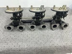 Volvo Penta AQ170 Triple Solex Carburetors W/ Intake Manifold Rebuilt. Fixed Price $650.00.